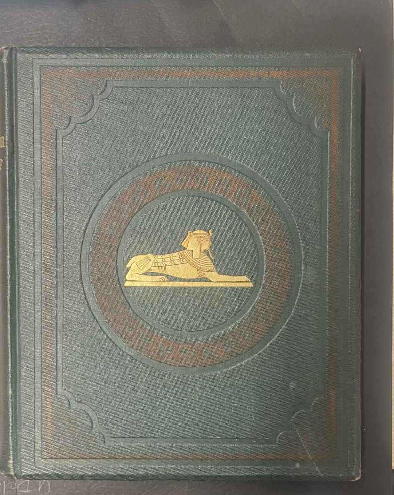 S064: Original green cloth front binding with gilt sphinx and brown-stamped decoration