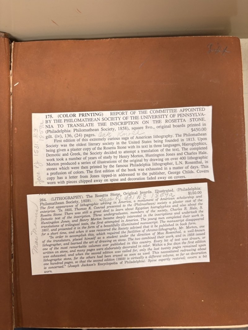 Endpaper with two pasted bookseller descriptions, for 1858 and 1859 copies, and the manuscript word “Gift”