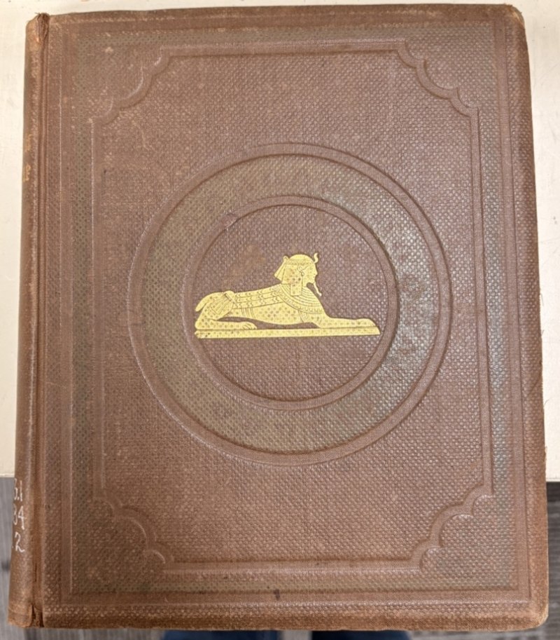 Front board with gilt sphinx and blind-stamped circular bands and borders