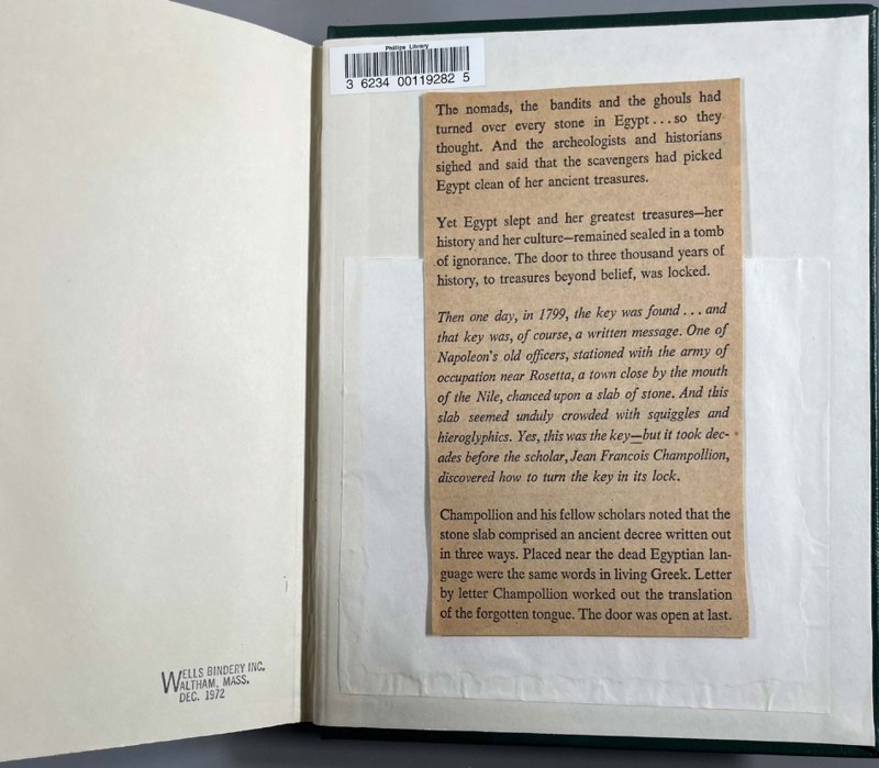 S052: Wells Bindery stamp and mounted Rosetta Stone clipping