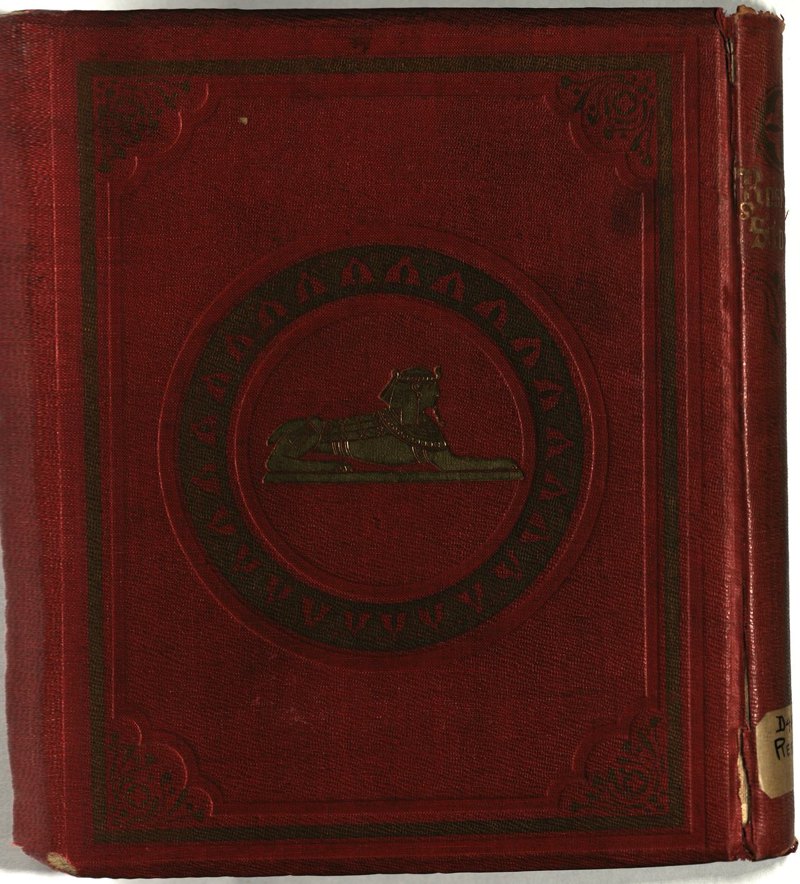 Red cloth rear board with gilt sphinx and stamped decoration