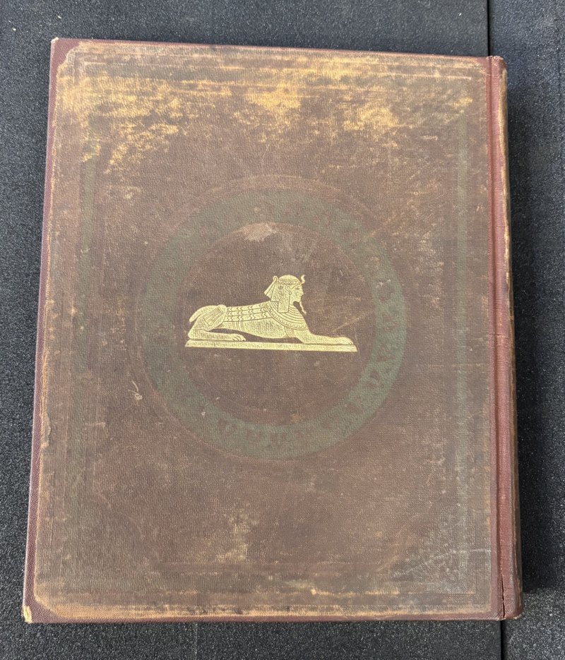 Brown cloth rear board with gilt sphinx and worn decoration