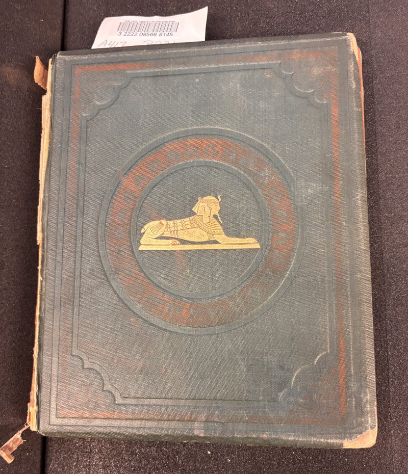 Morris family copy: original green publisher’s cloth front board with gilt sphinx and red stamped decoration