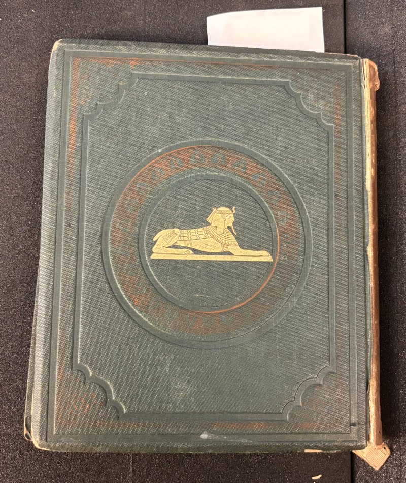 Green cloth rear board with gilt sphinx and red stamped decoration