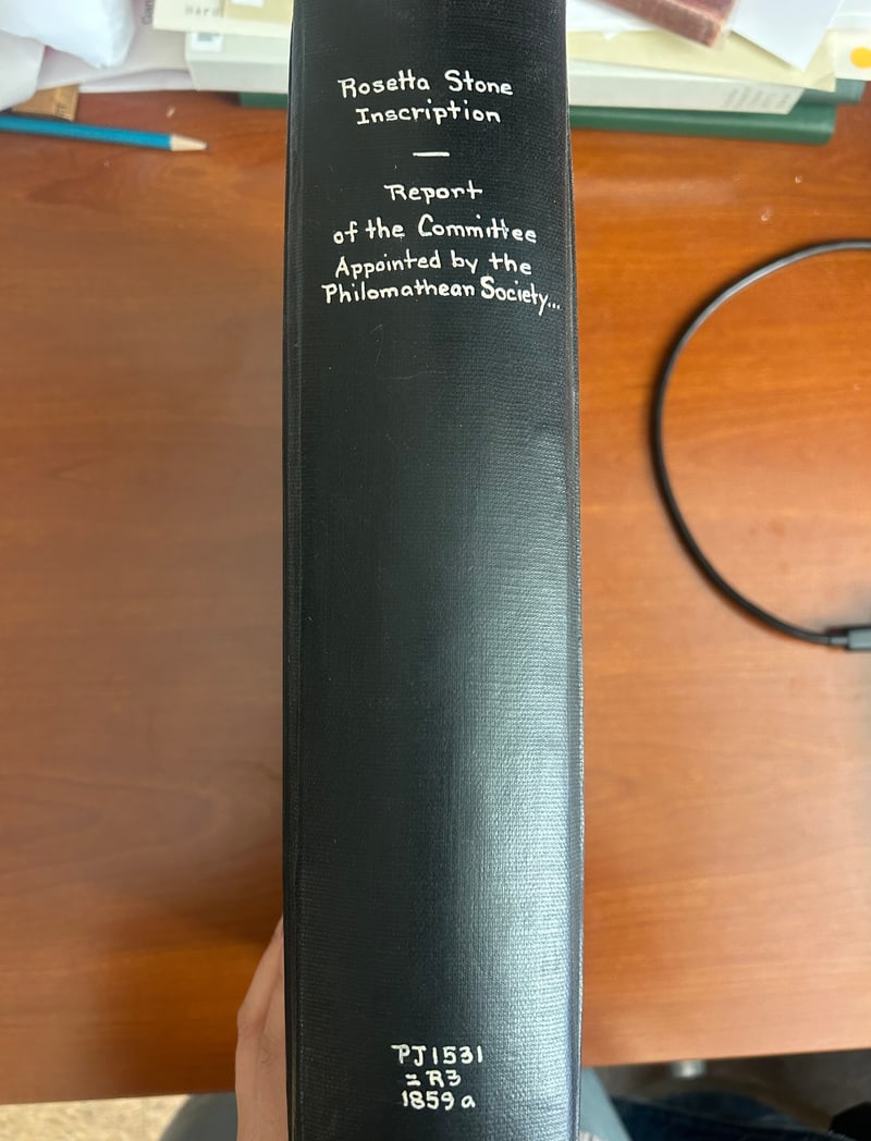 Spine hand-lettered in white “Rosetta Stone / Inscription / — / Report / of the Committee / Appointed by the / Philomathean Society...” with the call number PJ1531 =R3 1859a