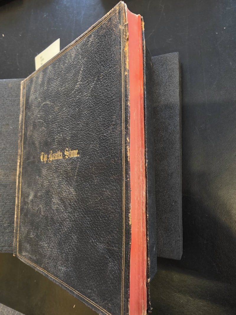 Front cover and fore-edge, showing the red edges