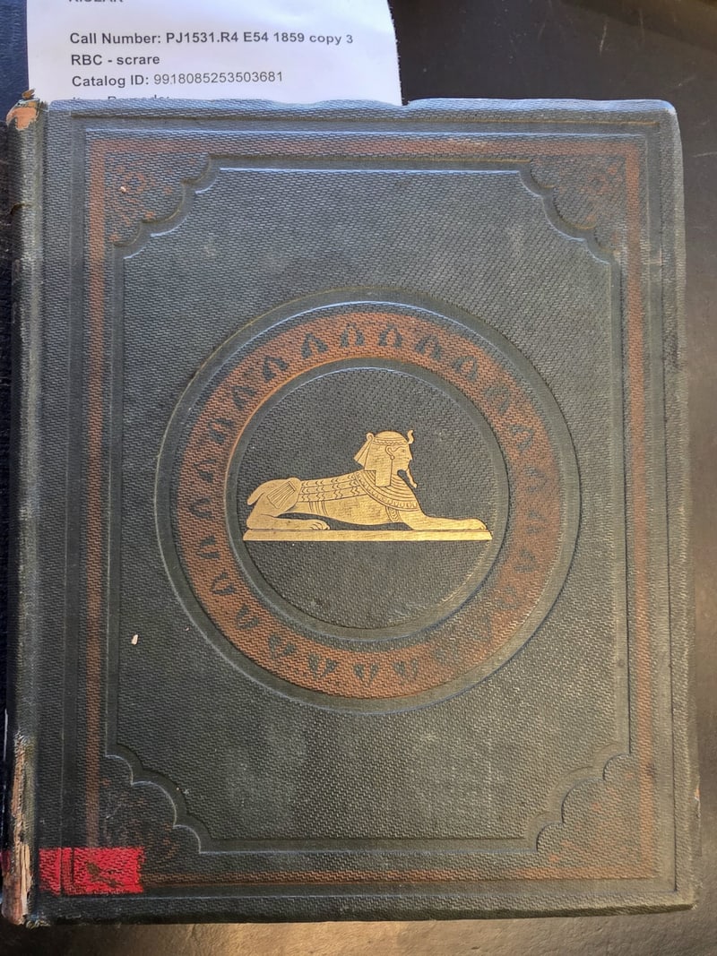 Original green cloth front cover with gilt sphinx