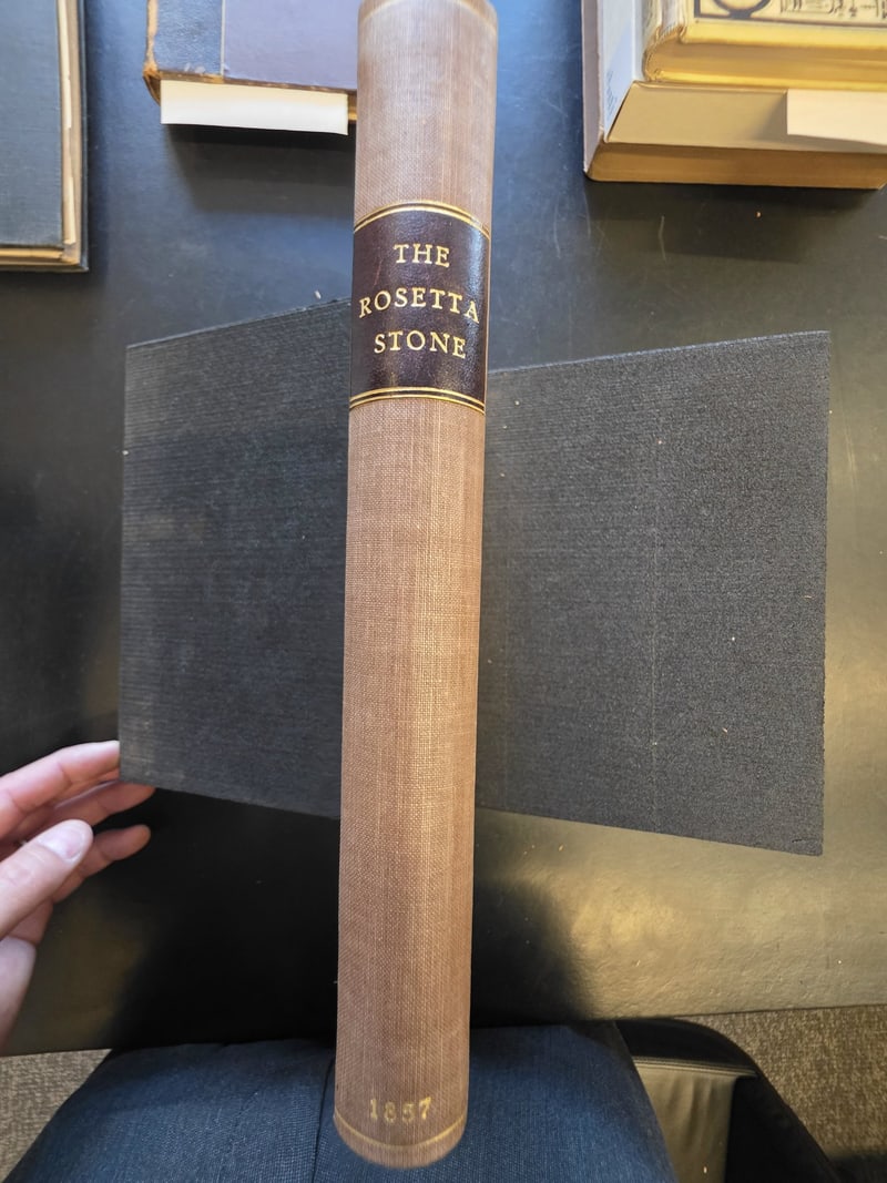 Spine label “The Rosetta Stone,” misdated 1857 at the foot