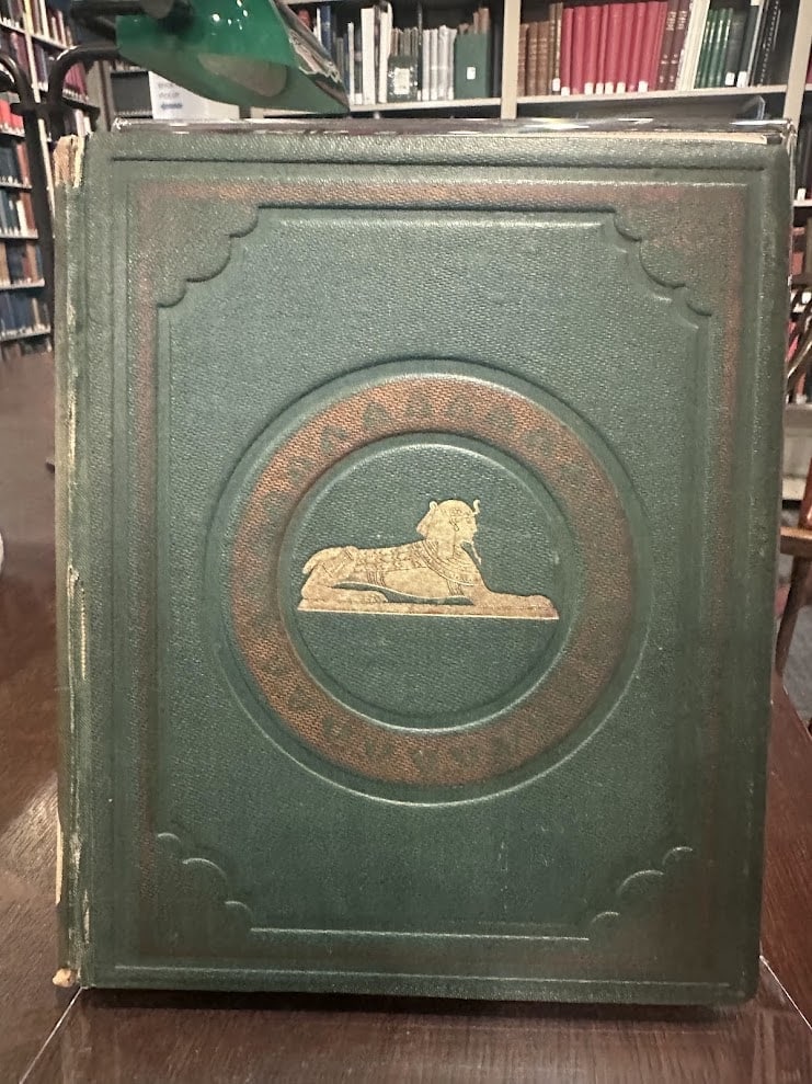 Original green cloth front cover with gilt sphinx and brown-stamped decoration