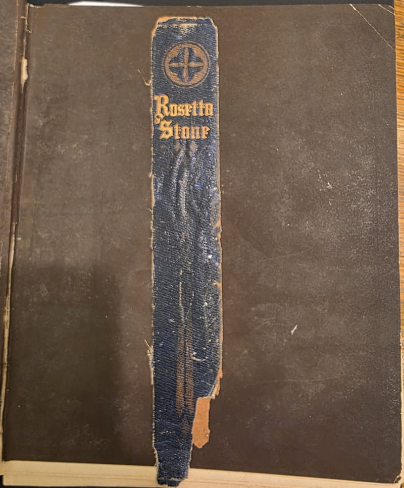 Detached original spine with gilt “Rosetta Stone,” laid down on the rear board