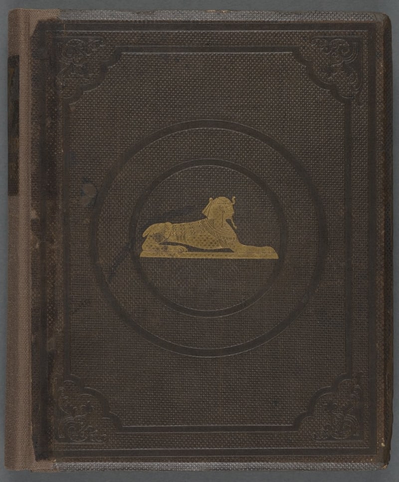 S083: Original brown cloth front board with gilt sphinx and blind-stamped ornament