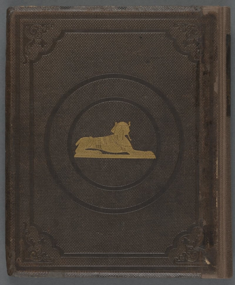 Brown cloth rear board with gilt sphinx
